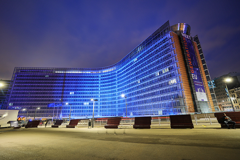 The European Commission’s Berlaymont headquarters in Brussels, illuminated in UN blue.