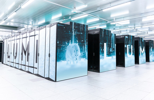 Four racks of Lumi supercomputer cabinets.